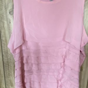 Pink sleeveless blouse.
